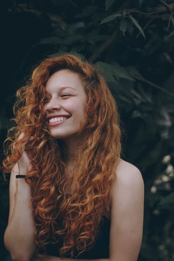 Smiling Woman With Red Hair