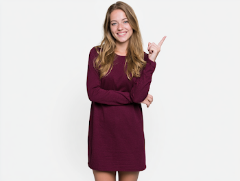 Smiling Young Adult Woman in Burgundy Dress Against White Background