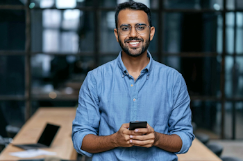 Smiling Young Professional in Modern Office