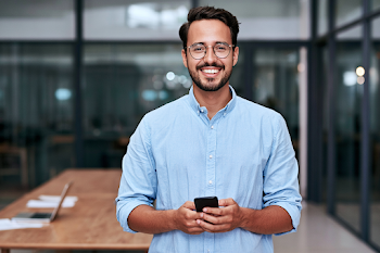 Smiling Young Professional in Modern Office