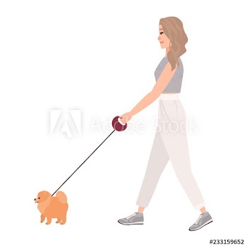 Smiling young woman dressed in casual clothing walking dog on leash