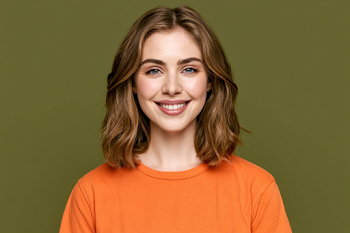 Smiling Young Woman in Bright Orange T-Shirt