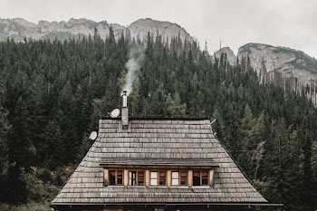 smoke coming out of gray house roof