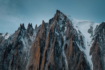 Snow Capped Brown Mountain