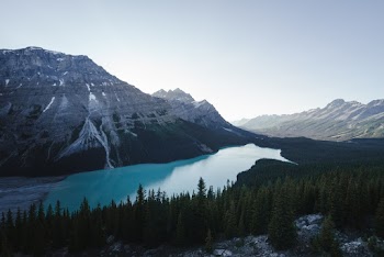 Snow Capped Mountain next to  Lake Under Blue Sky