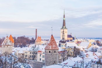 snow covered brown, white, and gray concrete castle under cloudy skies