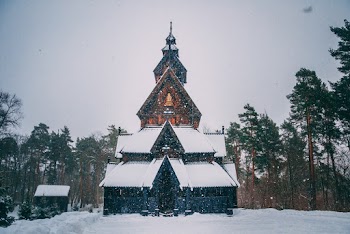 Snow-covered House Beside Trees