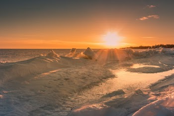 Snow covered lake ontario, golden hour.