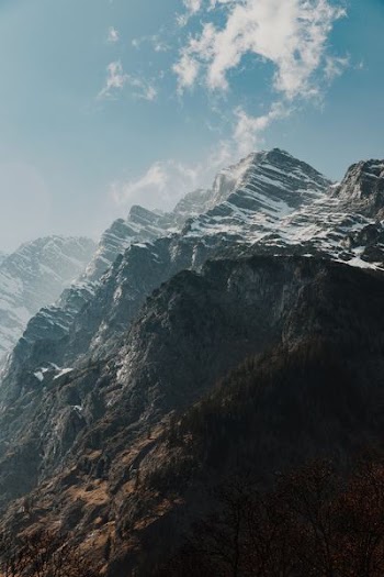 snow covered mountain during daytime