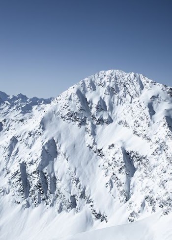 snow covered mountain during daytime