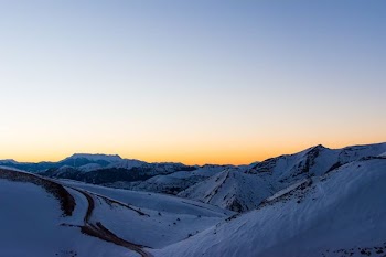 snow covered mountain during night time