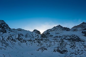 snow covered mountain under blue sky at daytime