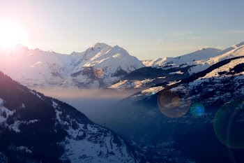snow covered mountain under clear blue sky