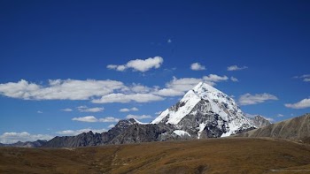 snow covered mountain under clear blue sky
