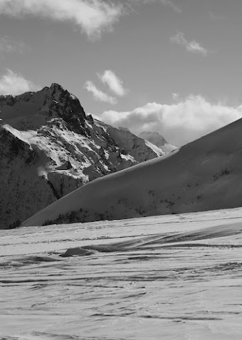 Snow Covered Mountain Under Cloudy Sky · Free Stock Photo