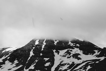 Snow-covered Mountain Under White Clouds