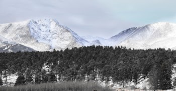 Snow Covered Mountains Under Cloudy Sky