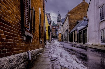 Snow Covered Road Near Buildings