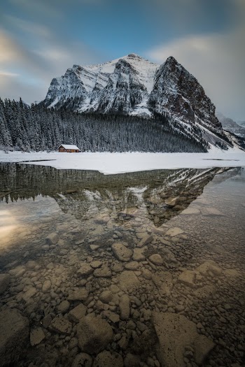 Snow Covering Mountain Near River