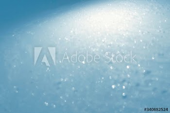 Snow reflecting the light textured background