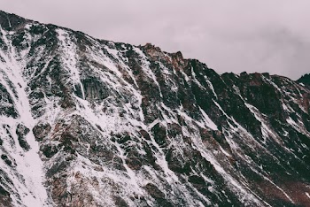 Snowcapped Mountains Under Gray Sky