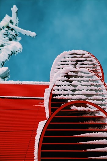 Snows on Red Roof Closeup Photo