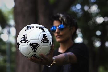 Soccer Ball In Palm
