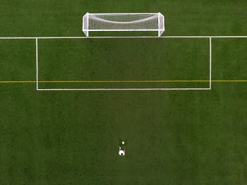 Soccer Player In Penalty Kick Position Drone View