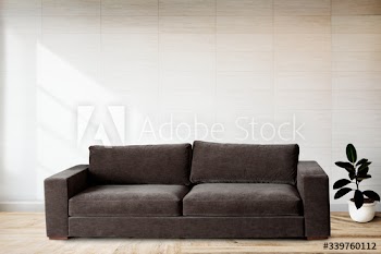 Sofa by a tiled wall