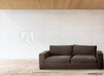 Sofa by a tiled wall