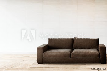Sofa by a tiled wall