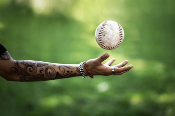 Softball Flies Above Hand