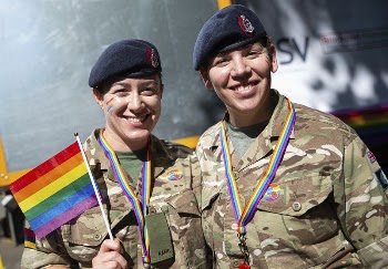 Soldiers showing rainbow flag, August | Free Photo - rawpixel