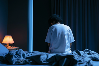 Solitary Reflection in Dim Bedroom