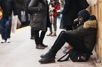 Somber Sitting Commuter Man