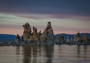 Some of the Tufas at Mono Lake. They are calcium carbonate formations formed at the bottom of the lake when the lake was deeper. LA water officials started buying water rights and draining the lake in the early 1900's. As the water dropped the tufas were exposed.     To learn how to take pictures like this, read my educational blogs at www.sharetimsphotos.com.