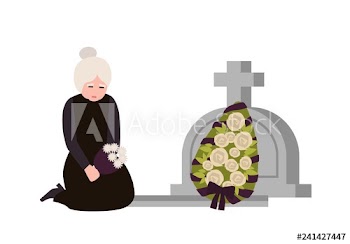 Sorrowful elderly woman dressed in mourning clothes crying near grave with headstone and wreath