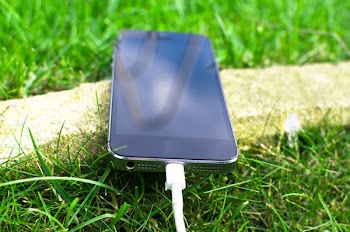Space Gray Iphone 6 on Green Grass