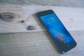 Space Gray Iphone on Wooden Surface