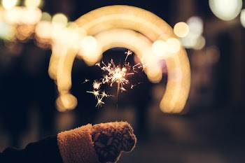 Sparkler and a wollen glove