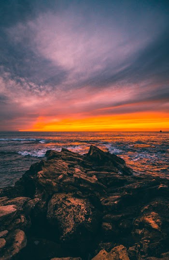 Splashing of Water Under Gray Sky during Golden Hour