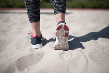 Sporty Woman Walking On Sand