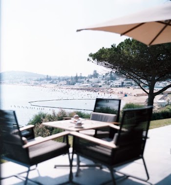 square brown table and four chairs patio set