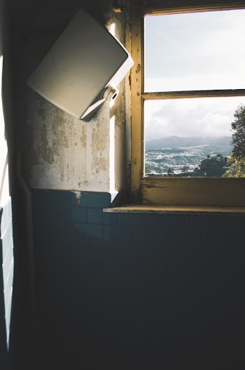 Square Gray Box Hanging Beside Window