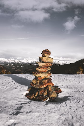 Stack Of Stones On Snow