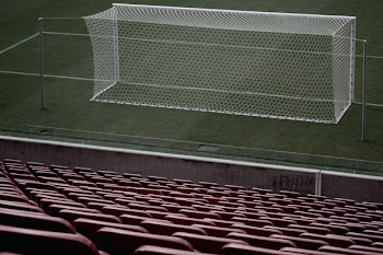 Stadium Seats Near White Soccer Goal