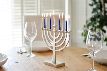 Stainless Steel Candelabra Beside Clear Wine Glasses