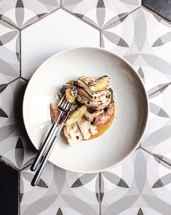 Stainless Steel Fork and Knife on White Ceramic Plate