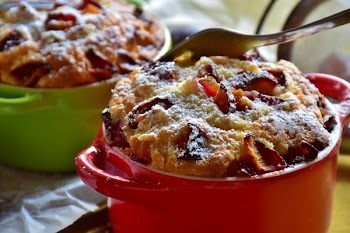 Stainless Steel Fork on Top of Brown Cooked Pastry on Top of Red Ceramic Mug