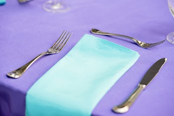 Stainless Steel Forks next to Napkin